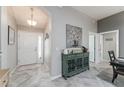 Inviting foyer showcasing tile floors and elegant decor at 1309 Piney Woods Path, The Villages, FL 32163
