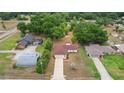 An aerial shot of a single Gathering home on a verdant lot in a quiet neighborhood at 14490 Se 96Th Ter, Summerfield, FL 34491