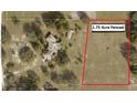 Aerial view showcasing a 1.75 acre fenced property with a home, barn, and mature trees at 23130 Brouwertown Rd, Howey In The Hills, FL 34737