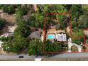 Expansive aerial view showcasing the property's layout, pool, mature trees, and surrounding landscape at 308 Sunnyside Dr, Leesburg, FL 34748