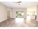 Bright and airy living room with vinyl floors and slider doors at 3177 Williams Rd, The Villages, FL 32162