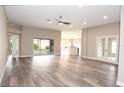 Spacious living room showcases modern design with natural light and vinyl floors at 3177 Williams Rd, The Villages, FL 32162