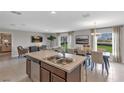 Bright, open concept with stainless steel appliances, dining and living areas offering great views at 4102 Penelope Ave, Lake Wales, FL 33859
