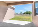 Concrete back porch provides a comfortable outdoor seating area at 4998 Abigail Dr, Lake Wales, FL 33859