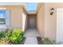 Covered walkway leads to the home's front door at 4998 Abigail Dr, Lake Wales, FL 33859