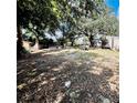 Expansive backyard featuring scattered shade and ample room for outdoor activities or future development at 5809 County Road 547 N, Davenport, FL 33837