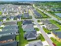 Overhead view of a neighborhood, showcasing the well-planned layout and green spaces at 6633 Holovak Ter, The Villages, FL 34762