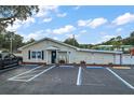 Exterior of a community center with accessible parking and manicured landscaping at 715 Surrey Pl, Leesburg, FL 34748
