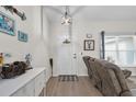 Bright entryway with neutral walls, wood-look floors, and stylish decor accents at 8635 Se 156 St, Summerfield, FL 34491