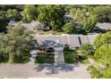 An aerial view of a charming home with a well-kept lawn, surrounded by lush green trees at 8738 Sw 95Th Ln # B, Ocala, FL 34481