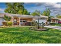 Charming single-story home featuring an attached garage and inviting front porch at 8738 Sw 95Th Ln # B, Ocala, FL 34481