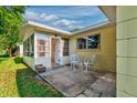 Outdoor patio space with seating, adjacent to a bright sunroom, offering a cozy spot to enjoy the outdoors at 8738 Sw 95Th Ln # B, Ocala, FL 34481