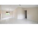 Bright living room with tile flooring, neutral walls, and a chandelier at 10442 Se 179Th Pl, Summerfield, FL 34491