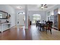 Welcoming dining room featuring hardwood floors and bright, natural light at 11126 Oakshore Ln, Clermont, FL 34711