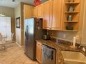Bright kitchen with stainless steel refrigerator and plenty of storage at 3083 Pinnacle Ct, Clermont, FL 34711
