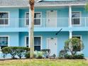 Exterior view of condo showing the front door, balcony, and nice landscaping at 3107 Sun Lake Ct # A, Kissimmee, FL 34747