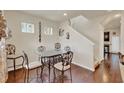 Dining area with hardwood floors, a glass top table, and decorative wall art at 534 Juniper Springs Dr, Groveland, FL 34736