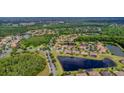 Expansive aerial view of the community highlighting the lush greenery, lakes and neighborhood at 537 Montage Ln, Kissimmee, FL 34759