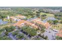 Stunning aerial view showcases the resort-style amenities, including the pool, surrounding the large lake at 537 Montage Ln, Kissimmee, FL 34759