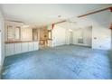 Spacious living room with built-in cabinets, ceiling fan, and ample natural light at 608 Saint Andrews Blvd, Lady Lake, FL 32159