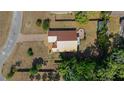 Aerial view of property highlighting the roof, the large lot, backyard patio and paved driveway at 6259 Se 120Th Pl, Belleview, FL 34420