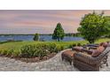 Beautiful patio with comfortable seating overlooking a serene lake view, perfect for relaxing and entertaining at 9648 Weatherstone, Windermere, FL 34786