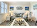 Serene living room with coastal decor, natural light, and stylish furnishings at 1342 Royal Saint George Blvd, Davenport, FL 33896