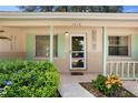 Inviting front porch with decorative accents and a cozy entrance to the home at 1416 Abigail Dr, Apopka, FL 32703
