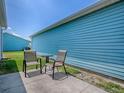 Cozy outdoor space with a table and chairs, perfect for enjoying the sunshine at 1722 Moreno Pl, The Villages, FL 32159
