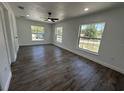 Bright bedroom features wood-look floors and large windows offering plenty of natural light at 2 Pine Terrace Way, Ocala, FL 34472