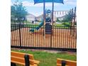 Community playground with a slide, climbing structure, and seating area, perfect for Gathering fun at 2106 Elio Ridge Dr, Zellwood, FL 32798