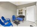 Cozy lanai area with comfortable seating, perfect for relaxing and enjoying the outdoors at 2457 Upton St, The Villages, FL 32163