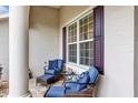 Cozy front porch with comfortable seating and stylish outdoor decor, offering a relaxing space at 3677 Arlington Ridge Blvd, Leesburg, FL 34748