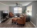 A comfortable living room with furniture and ceiling fan at 640 Mansfield Rd, Tavares, FL 32778