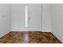 Clean entryway with modern white door and neutral tiled flooring, with great natural light at 8601 Se 133Rd St, Summerfield, FL 34491