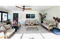 Bright and airy sun room with comfortable seating and a ceiling fan at 2227 S Spring Garden Ave, Deland, FL 32720