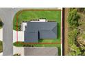 Ariel view of a single-story house with a well maintained yard, and new roof at 3984 Kanawha Pl, The Villages, FL 32163