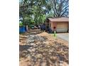 Spacious lot with a garage and workshop offering ample parking at 5643 County Road 173, Wildwood, FL 34785