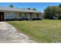 Quaint one-story house featuring a well-maintained lawn at 1022 E 3Rd Ave, Mount Dora, FL 32757
