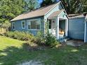 Older home exterior in need of some cosmetic upgrades and improved landscaping at 1225 E 1St Ave, Mount Dora, FL 32757
