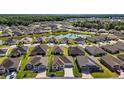 Aerial view of home showcasing serene lake view and neighborhood at 1627 Mclucas Ln, The Villages, FL 34762