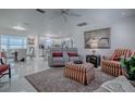Open concept living area with stylish seating and views into the kitchen at 17009 Se 96Th Chapelwood Cir, The Villages, FL 32162