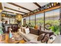 Inviting living room featuring stylish decor, comfortable seating, and sunny windows at 2160 Biller Cir, The Villages, FL 32163