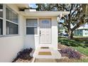 Inviting front entrance with a well-maintained doorstep at 30 E Key Ave, Eustis, FL 32726