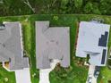 Aerial view of home, showcasing the roof, landscaping, and surrounding neighborhood at 4581 Shenandoah River Trl, Leesburg, FL 34748