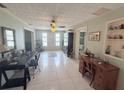 Spacious living room showcasing tile flooring, open layout, and natural light at 603 W Seminole Ave, Eustis, FL 32726