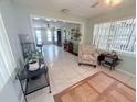 Bright living room with tile floors, a ceiling fan and comfortable seating at 603 W Seminole Ave, Eustis, FL 32726