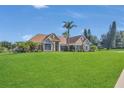 Charming single Gathering home with stone accents and lush landscaping at 7629 Lake Angelina Dr, Mount Dora, FL 32757