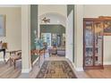 Inviting foyer with hardwood floors that leads to a spacious living area at 7629 Lake Angelina Dr, Mount Dora, FL 32757
