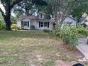 Charming single-story home features a classic design and mature trees in a lush front yard at 825 Mary Frank Ct, Mount Dora, FL 32757